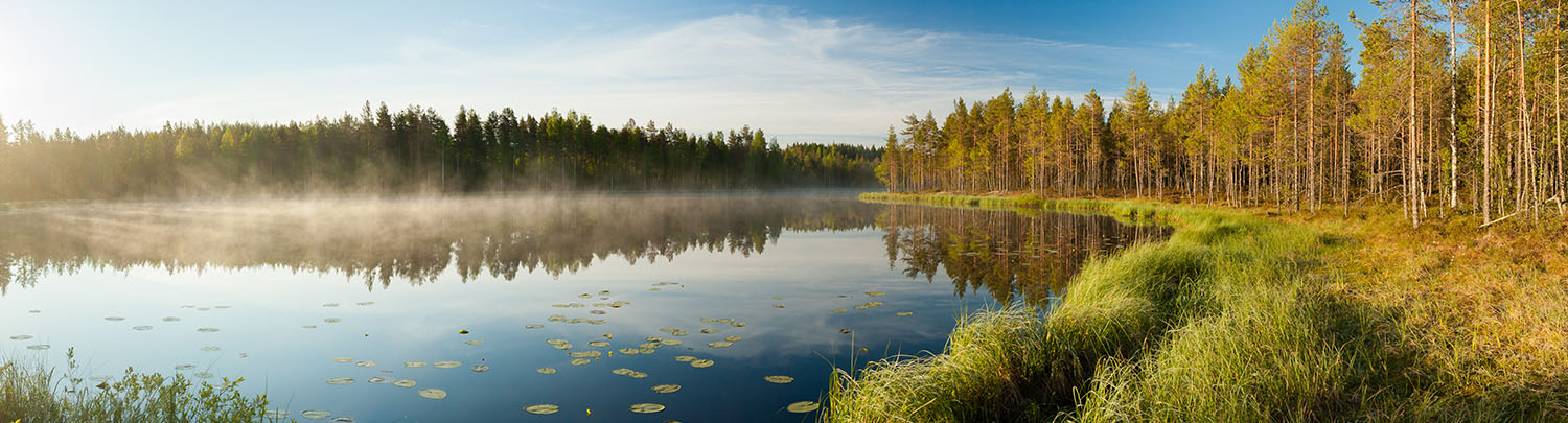 Image of a serene lake, similar to many lakes in the Portage College area
