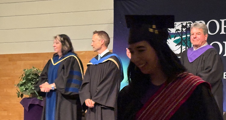 Brian Rudyk on stage as grads convocate