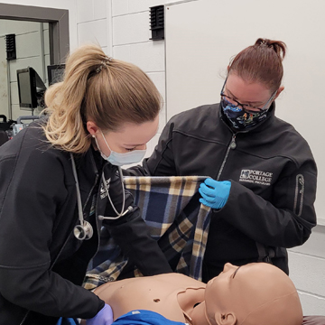 Chrissy and Chelsea Paramedic Students in Class