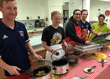 Mike Horrigan, Sara Stonehouse, Warren McDiarmid, Riley Woodruff and Jody Cardinal volunteering at the Royal Canadian Legion in Lac La Biche