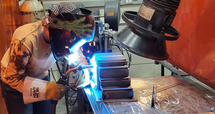 A high school student in the Skills Canada Welding competition works on her assigned project.