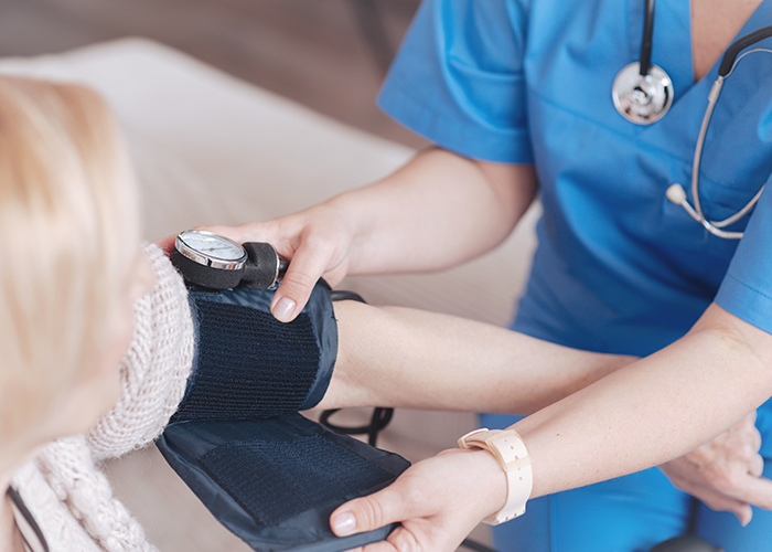 Image of nurse and patient